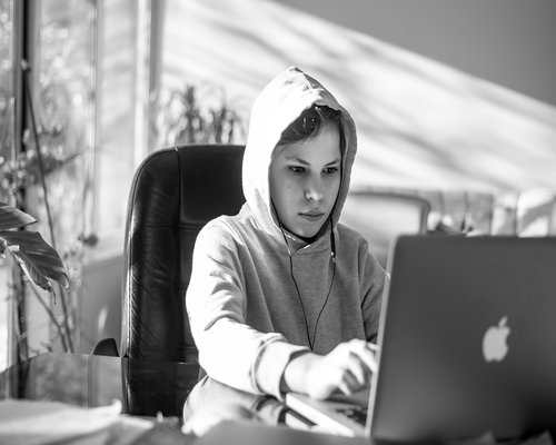 Student taking online classes at home